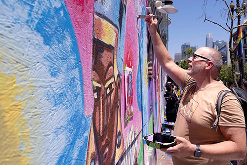 Volunteer at Diego's community mural